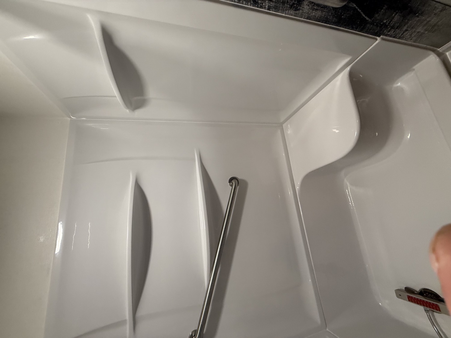 Accessible shower with built-in seat and grab bar